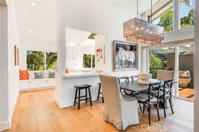 Light filled dining room leads to an outside deck