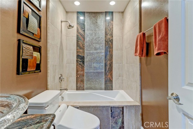 Floor-to-Ceiling Tile Surrounds Tub/Shower