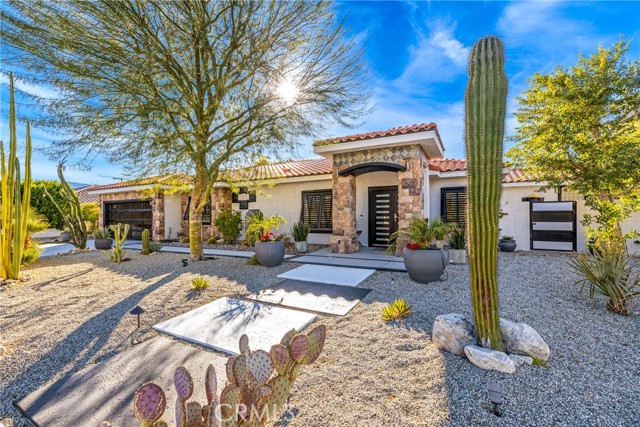 This is not just a house, it's an experience! The home comes fully furnished as a 4 bed, 2.5 bath, and 2368 sq ft! Start with the 12,000+ sq ft incredible corner lot landscaping that is designed with desert modern in mind. When you walk in, the stunning top to bottom features will take your breath away. This home was built for entertaining! The open kitchen with quartz countertops and newer appliances are perfect for whipping up a feast for your large group. And when the night is over, everyone can retire to their own spacious bedroom with the master having it's own bathroom and an exceptional bathtub to relax. Plus there's plenty of extra space in the backyard oasis with its pool and spa. Speaking of backyards, you don't want to miss this. The pool and spa are immaculate. The pool goes deep so you can fully submerge or simply lounge around on a hot day. Go around to the different places in the backyard to grill, lay in the hammock, play games, or sit at the table to enjoy the views. Let's not forget the potential game room in the garage with a split AC system built in, or just your place to put two cars. Plus you get all of this without any pesky HOA fees. It's fee simple, you own the land! This could be the perfect short term rental for Airbnb or VRBO. Or, if you're looking for a place to call your own, this is the one! ********