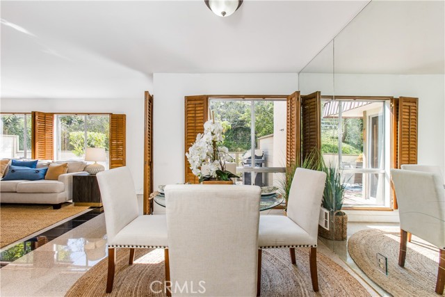 dining area adjacent to living room is a beautiful setting for morning coffee