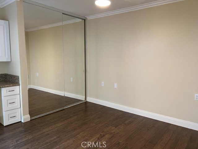 Guest bedroom has lots of closet space and pretty mirrored doors.