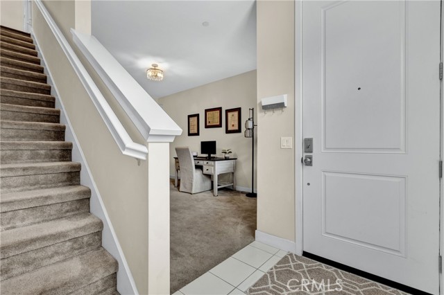 Entry area at bonus room stairs leading to main living area