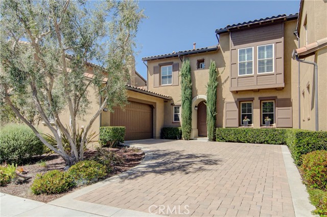 36 Tuscany Ladera Ranch, California This immaculate 3 bed, 2.5 bath attached single-family home is privately located behind the gates of the prestigious Covenant Hills community. The open floor plan is ideal with a grand kitchen island open to the family room, a fireplace, and french doors leading to a fabulous backyard. Enjoy outdoor dining under the gorgeous Spanish revival outdoor chandelier, relax by the outdoor fireplace under the cafe lights, and enjoy your favorite sports and entertainment under the covered patio (outdoor TV is included). Granite counters and high-end stainless steel appliances grace the kitchen, including fridge and wine fridge. A downstairs half bath, separate laundry room (with washer/dryer included), and attached 2-car garage with direct access are an added convenience. Upstairs you'll find all 3 bedrooms outfitted with beautiful light fixtures and new paint. The master ensuite features a spacious walk-in closet, jetted tub, walk-in shower, dual sinks/vanities, and french doors leading to a covered balcony. You'll love this quiet and quaint neighborhood with walking trails and nearby parks. The community amenities include a clubhouse, pools, tennis and sports courts. Live the life of luxury in this Covenant Hills escape!