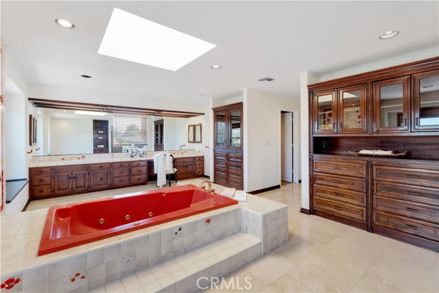 Massive master bathroom with skylight and plenty of storage.