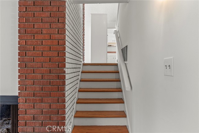 Stairs leading up from bonus/family room