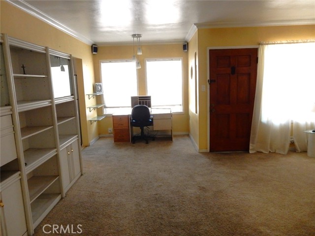 Nice desk area in the living room. Front door shown in the picture.