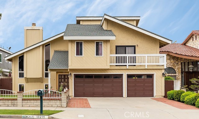 17211 Sims Lane Huntington Beach, California A large family home in a great location! Less than 1 mile from the beach. A Split level 4 Bedrooms / 3 Bath home with a 3 car garage on a large lot. The main level includes the Kitchen and dining area with a large enclosed patio / beautifully finished sun room, and one bedroom and bath. The family room is few steps down and could turn into a great movie/ play room. The formal living room with high ceiling and an impressive fire place is located in the mid level of the home. Upstairs you will find a huge master suite that includes an office and an adjoining nursery, both overlooking the private backyard. There are 2 additional bedrooms and a full bath upstairs, one bedroom which has a balcony facing the street.
The backyard has a built semi basketball court and a work shed with cabinets. Excellent schools and a great neighborhood within a short walk to the beach.