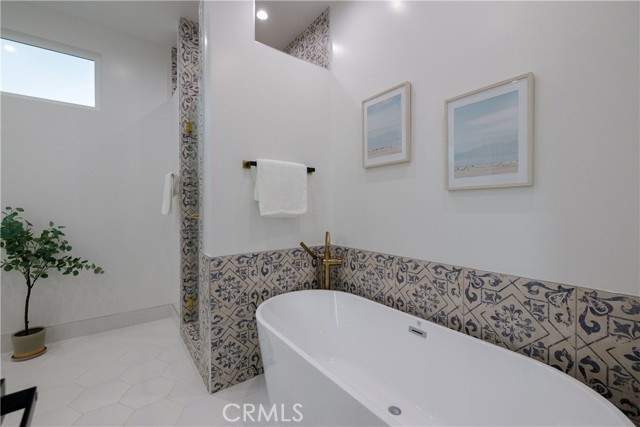 Deluxe Soaking Tub and Stylish Tile and Fixture Selections