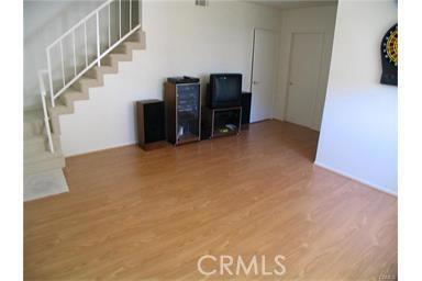 This room has been used as dance studio, media room, play room. There is a huge storage room straight in back and a small closet under stairs. The 4th bedroom is straight back from this photo along with full bath #3.
