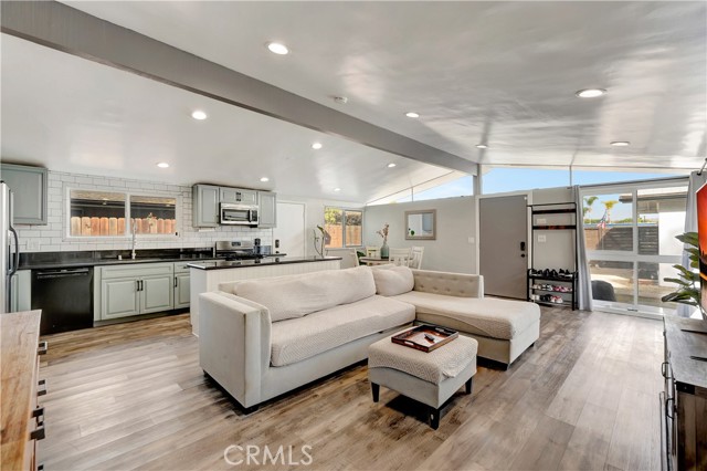 Open living area with clerestory windows above the ridge beam vaulted ceilings