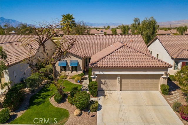 80342 Avenida Santa Alicia Indio, California Beautiful San Benito floor plan with Golf Course View & beyond of San Jacinto, San Gregorio & Shadow Mountains. TOUR: https://www.aryeo.com/v2/80342-avenida-santa-alicia-indio-ca-92203-us-679021/unbranded ......Remodeled w/designer features & tranquil outdoor rock fountain, 2 fire bowls, fire pit. Large master bedroom-golf course view, door to patio with Meshtec security screen, custom barn doors open to private remodeled oversized walk-in shower-custom tumbled travertine, new vanities-Cambria travertine, copper double sinks, medicine cabinets, make-up seating, travertine flooring & huge master closet + linen storage. Remodeled guest bath offers designer tile & built in niche. Crown molding throughout, tile flooring except for 2 bedrooms, custom paint throughout, newer window coverings and shutters. The kitchen is every chefs dream with space for everything! Cabinetry has been re-glazed in a rich tone & offers a separate eating space as well as a counter bar for breakfast dining. Adjacent is a formal dining space opened to a great room with glass windows across the back bringing the picturesque surroundings in while you entertain or just relax to the sound of the fountain. Enjoy outside dining under the Alumawood patio cover while listening to the sounds of nature- Garage offers 2 car spaces + golf cart parking, evaporative cooler (installed 2017), epoxy flooring, tons of cabinetry, newer garage door motor, HVAC system upgraded in 2014 to an efficient Hydes system.