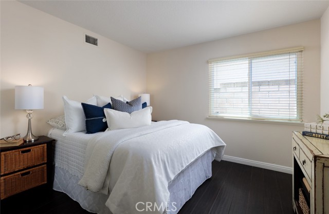 Main Floor Bedroom with Mirrored Closet and 3/4 Bath Nearby