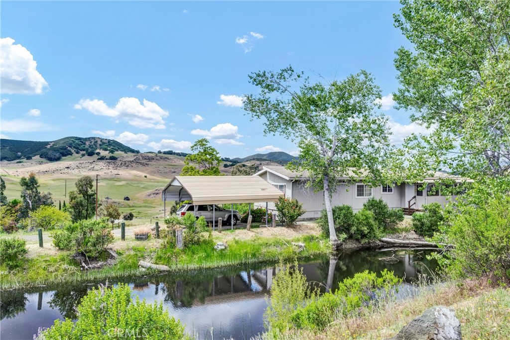 Mini Ranchette with 2 homes located in the heart of North Lakeport. This well maintained 2-bedroom + den, 2-bathroom manufactured home offers 1,440 square feet of comfortable living space, thoughtfully situated on just over 3.5 acres of usable, scenic land. Assumable solar + battery back up "power wall" services the entire property for energy efficiency! Inside, you’ll find a spacious living room filled with natural light and countryside views, perfect for relaxing or entertaining. The kitchen features ample cabinet space, a functional layout, and direct access to the dining area, making meal prep and gatherings a breeze. The primary bedroom includes a private en-suite bathroom and generous closet space, while the second bedroom and den offer flexibility for guests, a home office, or additional living space. 

One of the standout features of this property is the fully converted shop, offering approximately 900 additional square feet of separate living space. Complete with its own bedroom, bathroom, kitchen and open living area, this space is ideal for extended family, guests, or even has income potential as a rental!

Outdoors, the property truly shines with a variety of features that blend functionality and natural beauty. It’s cross-fenced and ready for livestock, with multiple outbuildings equipped with power for storage, workshops, or animal care. A terraced patio area behind the main home includes a swim spa—perfect for relaxing while enjoying the expansive views. There’s also covered RV parking with full hookups, a large seasonal fish pond, and a variety of mature trees throughout.

Located in desirable North Lakeport, this property offers the peace and space of country living with the convenience of being close to town. Lake County is known for beautiful Clear Lake, award-winning wineries, outdoor recreation, and small-town charm. Whether you’re looking for a peaceful homestead, a multi-family setup, or income potential, this property has it all—comfort, space, and endless possibilities.