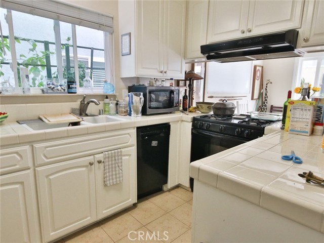 This photo is the kitchen today.  A little cluttered, but in nice condition.