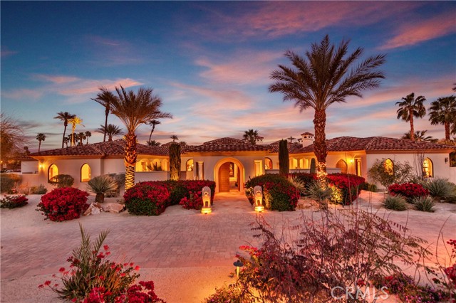 2 Strauss Terrace Rancho Mirage, California Entering the foyer gallery of this Mediterranean villa, the Italian marble columns, alcoves and niches make it clear that you've entered a home created for the celebration of art. A home to nourish and indulge the senses to enliven the spirit. Such a home inspires serenity and meditation, but is also a playground for exhilarating entertainment and family gatherings that become joyous memories. A walled compound in a private neighborhood off private and prestigious Clancy Lane; it is quiet, peaceful and serene, yet it is only one mile from shopping, dining and recreation areas of Rancho Mirage. A home where the comfort of indoors blends with the light and freshness of outdoors, the perfume of the rose, jasmine and citrus blossoms enter from two courtyards, the outdoors is never more than steps away. The master suite is spacious and well designed, transitions from bedroom to bath to double master closet. Dual studies for contemplative enjoyment of library collections. The kitchen is superlative, with the amenities one would expect from a home of distinction, with a nook for simple dining, and nearby the family room and bar. Guests arrive to enjoy the warmth of the formal living room, then move to the formal dining room a visual feast in itself. Full wet bar service area and wine cellar are positioned nearby. Suites for guests or extended family are adjacent, providing them with privacy while making them feel a welcome part of the environs.