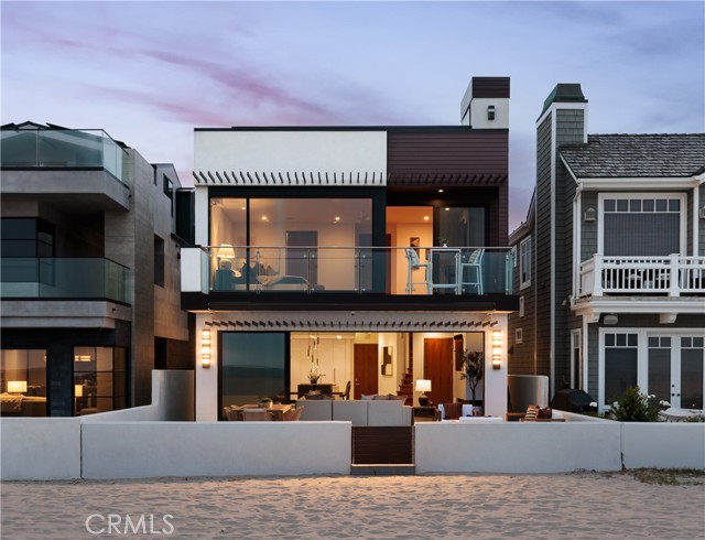 Welcome to coastal luxury redefined. Perfectly positioned directly on the sand in Newport Beach, this completely remodeled modern masterpiece offers the ultimate oceanfront lifestyle. With 3 spacious bedrooms, 3.5 designer bathrooms, and a sleek contemporary design throughout, this stunning two-story home is the epitome of Southern California elegance and comfort. Step inside and be captivated by panoramic ocean views, high-end finishes, and an open-concept layout that blurs the line between indoor and outdoor living. The gourmet kitchen features top-of-the-line appliances, custom cabinetry, and an oversized island perfect for entertaining. The living area opens seamlessly to the beachside patioâ€”ideal for morning coffee, sunset cocktails, or simply soaking in the sound of the waves. Upstairs, retreat to the luxe primary suite with its own private balcony overlooking the Pacific, spa-inspired ensuite bath, and generous closet space. The additional bedrooms offer comfort and privacy for family or guests, each with their own en-suite bathrooms. But the crown jewel? A private rooftop deck with 360-degree views from the coastline to the city lightsâ€”your own exclusive oasis for entertaining, sunbathing, or star-gazing. Located just steps from world-class dining, shopping, and the N