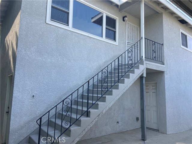 stair access to rear 2 bedroom unit