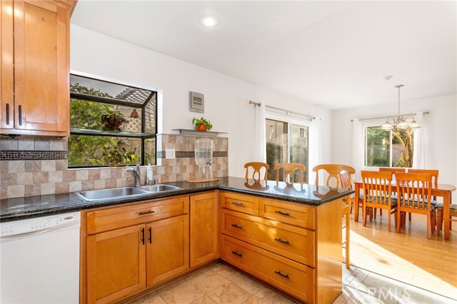 Kitchen with bay window overlooking backyard