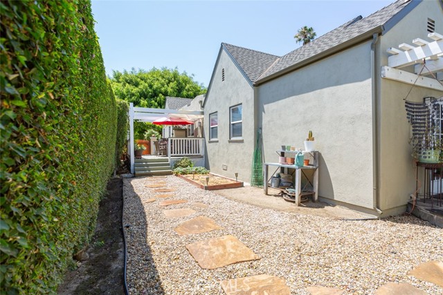 side yard, view of house and deck