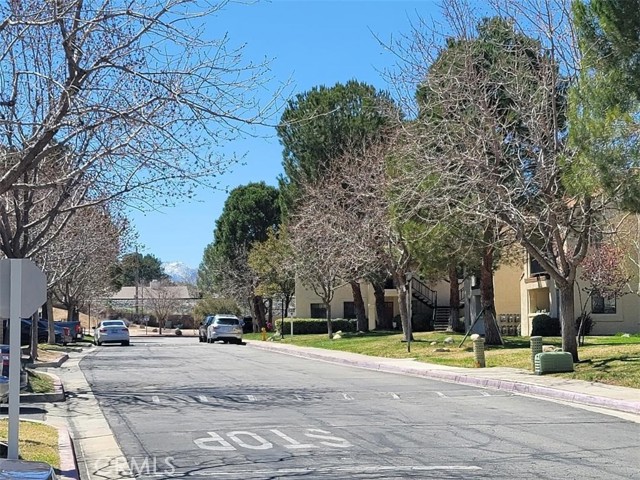 Rare opportunity to own this 2 bedroom 2 bathroom condo in this well maintained gated community in one of the most desirable areas of Palmdale.  New trendy water proof laminated flooring all through the unit. The kitchen has plenty of cabinets,  granite countertop, newer stove, and dishwasher.   Minutes away from church, schools, and walking distance to shopping centers with Stater Bros, Food 4 Less, resturants, easy freeway access, proximity to public transportation  and many more... Public swimming pool, spa, on site laundry, on site security guard, designated cover parking, plenty of guest parking, and park-like landscaping with mature trees and roses.   You have to see it to appreciate this beautiful condo called home. Listing agent is one of the nowers.