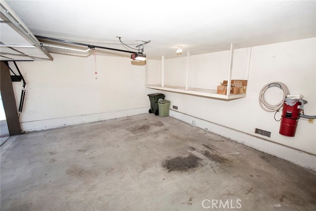 2-Car, direct access garage w/electric opener, storage shelves, built-in vacuum system