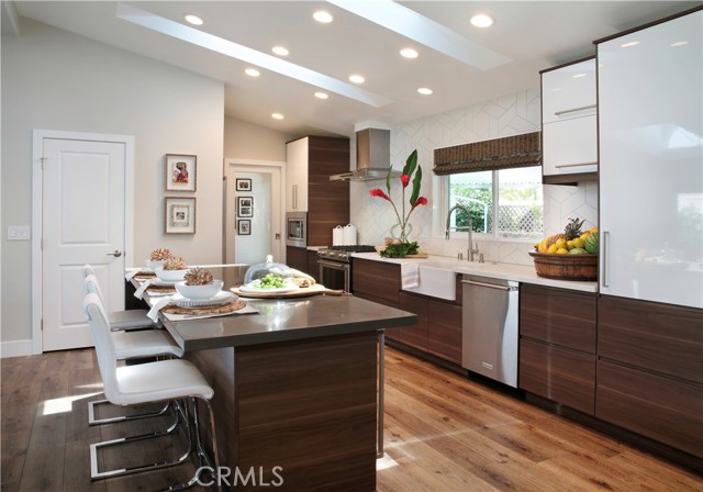Kitchen view towards walk-in pantry, laundry area and rear entrance.