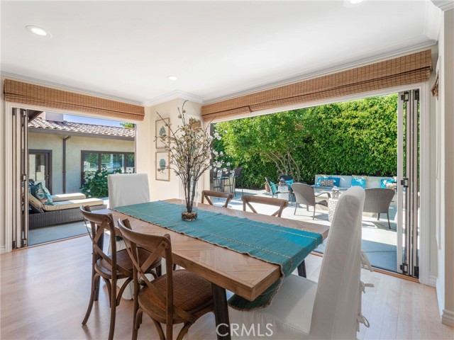 Informal dining in great room toward rear patio