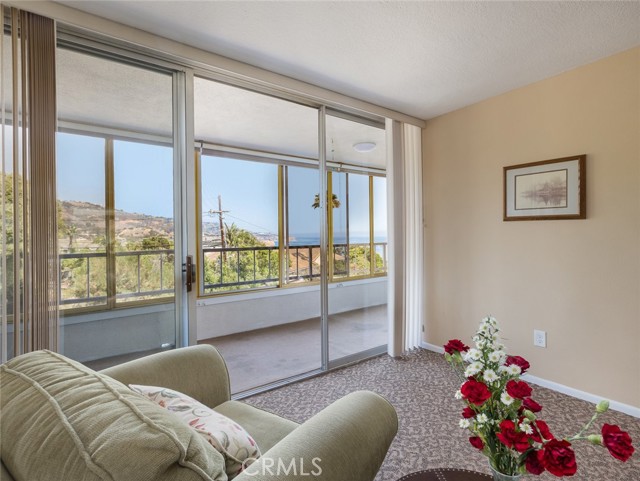 Huge master bedroom has sitting area with views of ocean