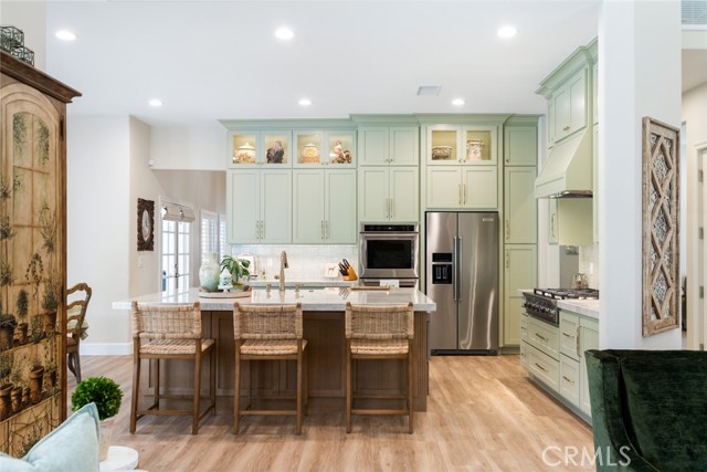 This is such a fun kitchen for your holiday cookie baking and memory making. The double ovens both have multi functions and convection features. The 6 burner stove top comes in handy when you are preparing holiday meals.
