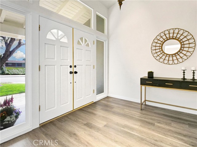 Beautiful entry with new luxury vinyl flooring.