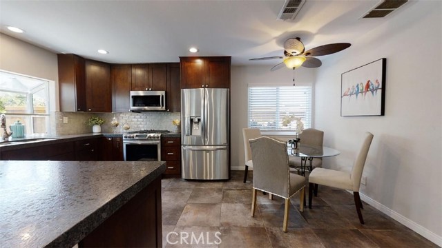 Stainless steel appliances, recessed lighting, breakfast nook or family dining
