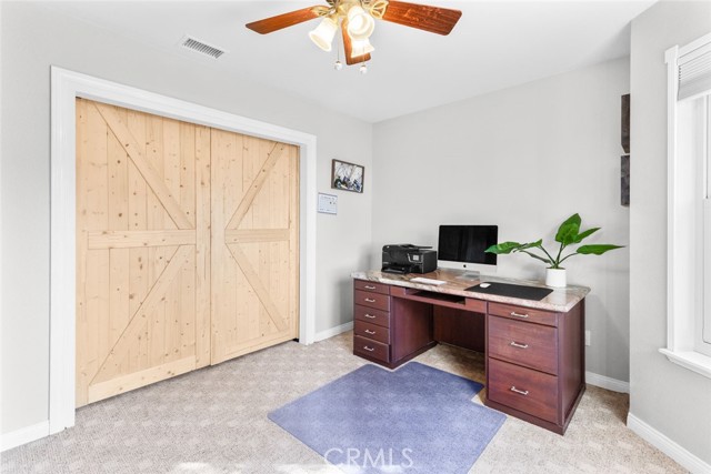 4th bedroom / home office with barn doors closed.