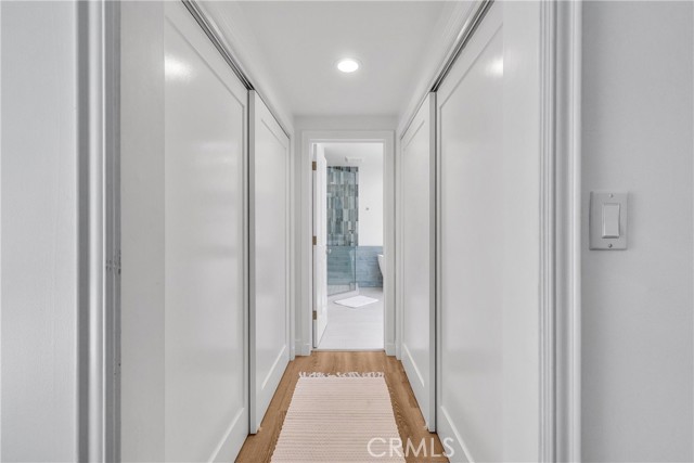 Hall to Primary Bathroom with plenty of closet space