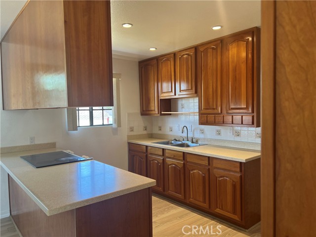 Custom cabinets,Corian countertops, recessed lighting