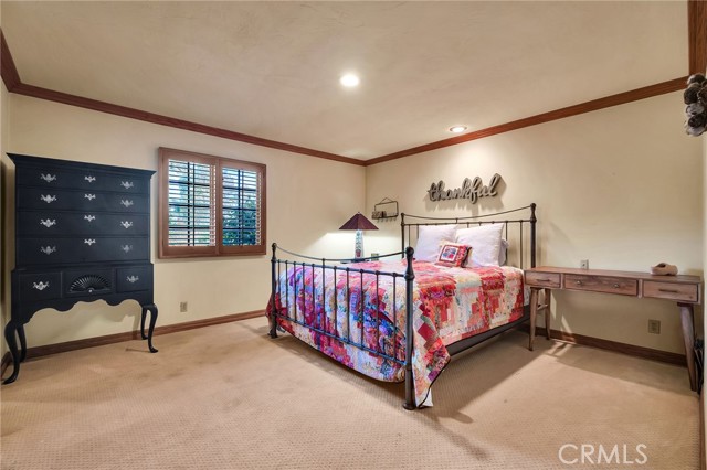There are 3 large bedrooms + 2 full baths below the family room.