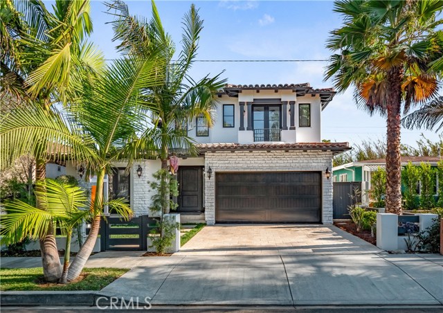1350 Gates Avenue Manhattan Beach, California Light and airy custom Santa Barbara home with expansive views sits high on a tree-lined and super quiet street! Newly remodeled, inside and out, this beautiful home has an open-concept floor plan with large expansive windows that offers plenty of natural light in each room. A chef’s dream kitchen comes with a Viking cook-top, professional Bosch refrigerator, stainless steel appliances, custom cabinets, and an oversized quartz waterfall island. The kitchen and living room opens up to the stone patio with a built in BBQ and fireplace overlooking an open valley of Manhattan Beach. New wood and tile flooring throughout. Master bedroom suite with a huge walk-in closet comes with a spa-like bathroom and private deck. Upgraded audio system, fresh paint, lush landscaping, and walking distance to Pennekamp Elementary and Mira Costa High School. This beautiful and private home is an unmatched entertainers dream with perfect southern exposure in beautiful Manhattan Beach!!