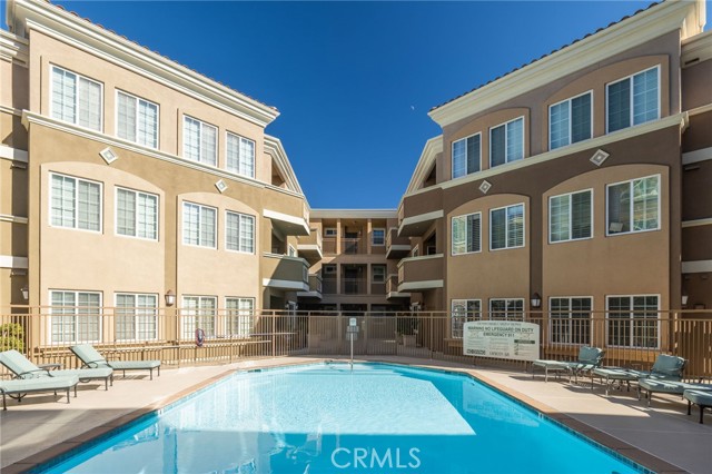 Recently updated pool is a beautiful amenity of the complex. Community room is shown at lower right.