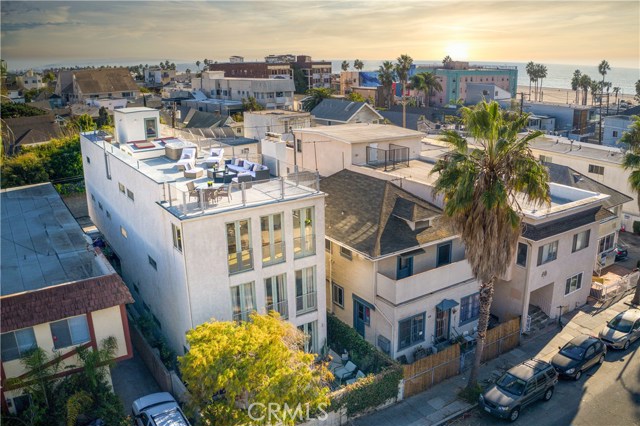 46 Rose Avenue Venice, California Soho meets Venice Beach! One block from the sand. Two open and airy homes totaling an amazing 4,626 sq. ft. with an industrial architectural spin. Built by Hope Alexander, renowned Venice Architect and daughter of famous California artist Peter Alexander. The upper unit is an expansive 2 bedroom, 2 bath & 2,400 sq. ft. Private staircase provides access to an enormous rooftop deck with jacuzzi & lounge area, offering prime sunset-viewing with its 360-degree panoramic views of the San Bernardino mountains and the ocean. The industrial architecture features high ceilings, skylights, floor-to-ceiling windows, finished concrete floors, wide-open kitchen, fireplace, no walls or hallways, and a dumbwaiter elevator. The lower unit is 2,226 sq. ft. is currently 1 bedroom, den and 2 baths—of course the den could be a bedroom. The property can be converted to one extraordinary single-family residence (buyer to verify).
Gated four car parking (2 each unit). This unique & contemporary space is next to the beach and Main Street. Short walking distance to both the Abbott Kinney Blvd. & Rose Avenue shopping districts, with its many upscale boutiques, shops, fine restaurants, and wine bars. On top of the other elements, this home is situated near Silicon Beach, Venice Canals, the award-winning Coeur d'Alene Elementary School, and the fabulous Claire Fountain-school. This is the best of Venice!