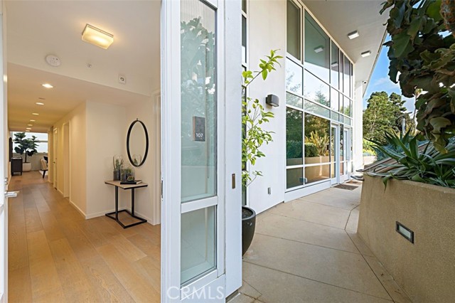 1705 Ocean Avenue 107 Santa Monica, California Seller to entertain offers. The perfect lock and go home in amazing location, just steps from the beautiful Santa Monica beach and walking distance to all the shopping and dining Santa Monica has to offer. Beautiful 2 bed, 2 bath two-story townhouse in the Waverly building, designed by Marmol Radziner and developed by award-winning developer, Related California. This inviting residence is on the first floor and features hardwood floors, lots of natural light and a main floor bedroom. The great room is perfect for entertaining with two-story ceilings and an open gourmet’s kitchen featuring Oak cabinets, Quartzite countertops and Thermador appliances. The spacious upstairs master suite offers a large walk-in closet and spa-like bath with Quartzite counters and tile accented shower and soaking tub. The unit also includes an interior washer and dryer as well as 2 indoor parking spaces which have been specially equipped for EV charging stations and owner's storage space. Enjoy utmost convenience with all the amenities the building has to offer, including a fitness center, 24-hour concierge, pet spa and lounge with full kitchen and ocean view for your own private dining events. No amenity has been overlooked - this is the perfect spot to call home!