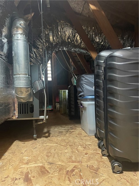 Tons of shelving and lighting added to the attic for storage