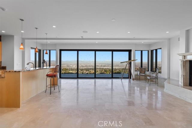 Great room with fireplace and second kitchen