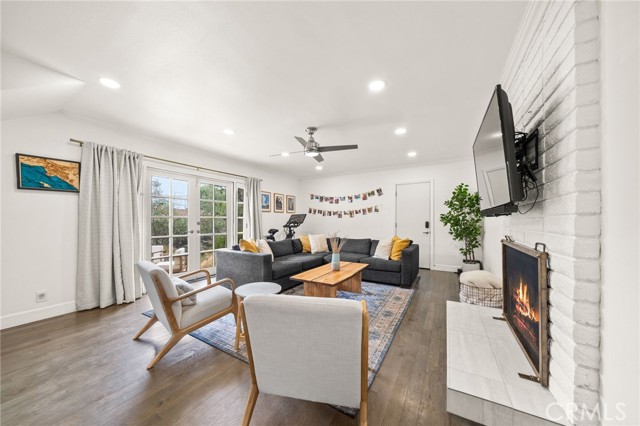 Fireplace family room with french doors to lush backyard