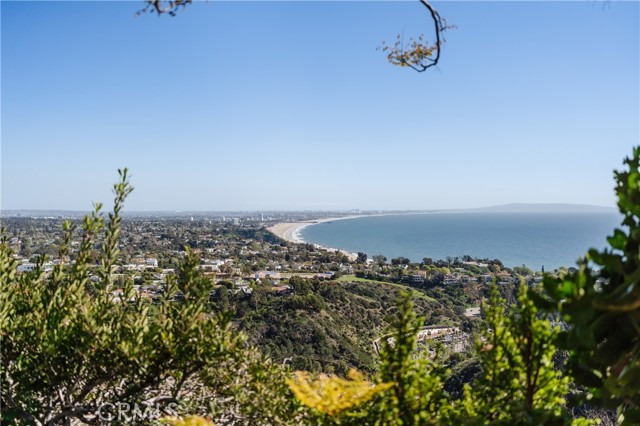 A rarity with a one-of-a-kind view. Enjoy panoramic and endless coastline curvature views of the Queen's Necklace, Santa Monica Pier and Beach, Catalina, Beach, Mountains, Downtown LA. Perfect redevelopment opportunity to create your dream home on over 1.8 acres. No neighbors on either side, private street and entrance. Close to PCH in Pacific Palisades. Renderings coming soon.