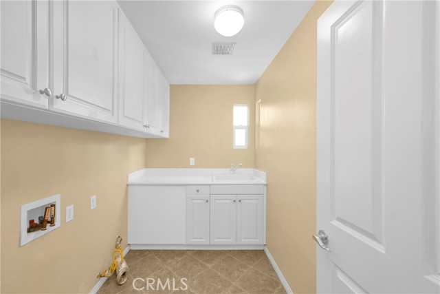 Laundry Room in between bedroom 3 & 4.