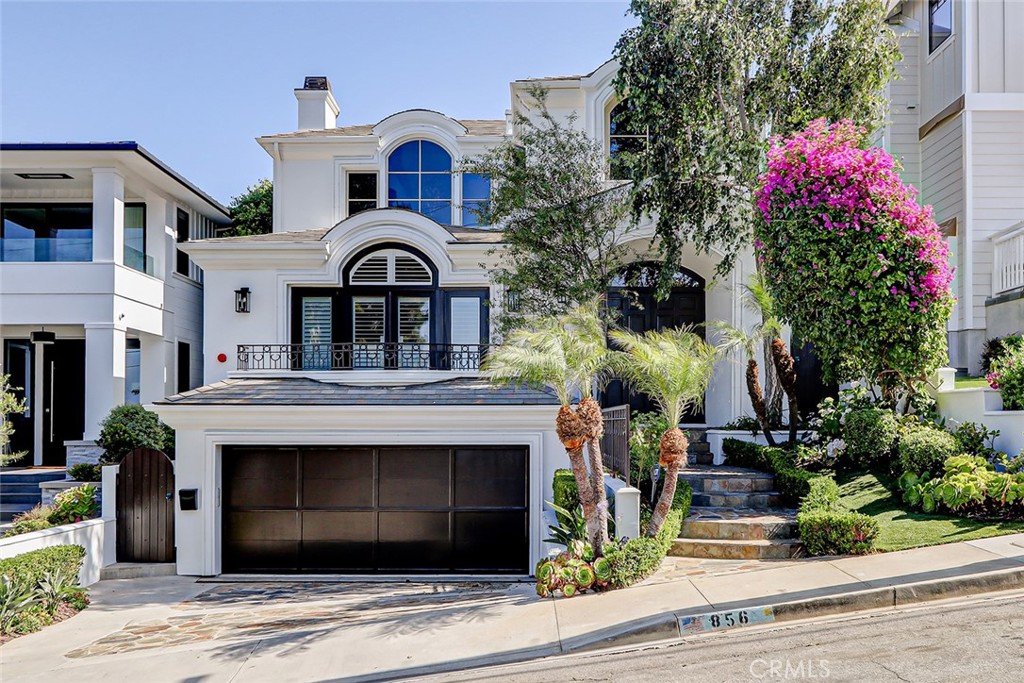 Light, bright, and beautiful, this home is the perfect blend of style, functionality, size, outdoor space, and LOCATION. Sitting atop a large sun drenched lot, this 4,300 sq ft home, has four bedrooms (All on the lower level) plus a great office with inspiring views of Downtown LA, the San Gabriel mountains, Sofi Stadium, and sparkling city lights. The recently updated kitchen has all of the bells and whistles and is the centerpiece of the open and light second floor living area. It features a large center island with seating, breakfast nook, butlers pantry that opens to a formal dining room, and a private patio nearby that is perfect for dining al fresco. The private master suite is comfy and warm with a recently updated master bath and ample closet space.  The incredible sunny south facing backyard has a LARGE elevated grassy yard that is perfect for a pool and spa creating resort-style living. The large lower level living room opens up to a functional and private patio, perfect for hanging out. (Lot size is 40' X 145') Other amenities and features include... 3 separate living spaces, sweeping entry staircase PLUS a convenient second set of 'family' stairs, Central AC, hardwood floors throughout, 3 car garage, and much more. The location is great, just a few short blocks to the vibrant downtown shopping and dining district, award winning schools (Robinson and Pacific), and of course the beach!