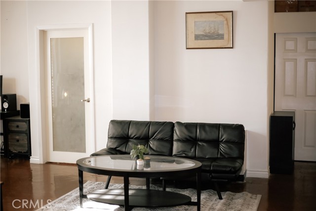 Second smaller living area in between the bed and bathroom.