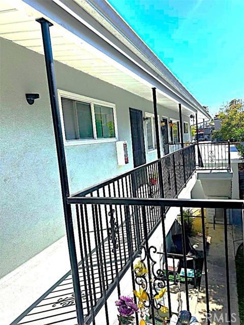 There are Three Units on the Upper Level Enclosed by the New Railings. This is the View Looking From the Front of the Building Towards the Rear. There are Three Units on the Upper Level Enclosed by the New Railings. This is the View Looking From the Front of the Building Towards the Rear.