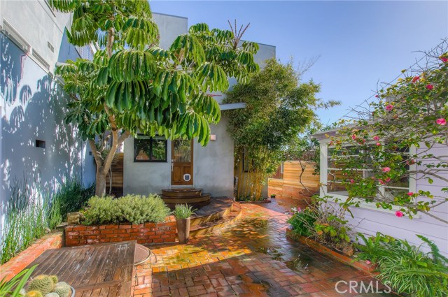 Backyard showing guest cottage to the right