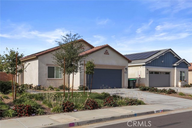 1037 Burdock Court Calimesa, California Beautiful 3 bedroom, 2 bathroom, single story home with paid solar panels in the community of The Retreat at Summerwind Trails in Calimesa! Enjoy a light, bright floor plan with laminate wood flooring and a gourmet kitchen. The kitchen features a center island, granite countertops, and stainless steel appliances. The primary bedroom offers a walk-in closet, dual vanities in the primary bathroom, and a walk-in shower. Sliding doors lead to the covered outdoor patio with ceiling fans and a fire pit. Additional property highlights include an inside laundry closet and a 2 car garage. Convenient to area golf courses, hiking trails, markets, and major freeways!