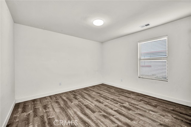Bedrooms have solid surface flooring.